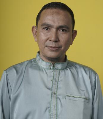 Syahril, S.Kom M.Kom
